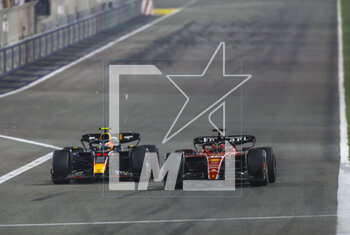 2023-03-05 - 16 LECLERC Charles (mco), Scuderia Ferrari SF-23, action with 11 PEREZ Sergio (mex), Red Bull Racing RB19 during the Formula 1 Gulf Air Bahrain Grand Prix 2023, 1st round of the 2023 FIA Formula One World Championship from March 2
3 to 5, 2023 on the Bahrain International Circuit, in Sakhir, Bahrain - F1 - BAHRAIN GRAND PRIX 2023 - RACE - FORMULA 1 - MOTORS