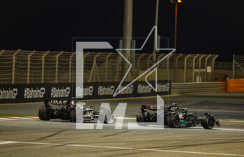 2023-03-05 - 20 MAGNUSSEN Kevin (den), Haas F1 Team VF-23 Ferrari, action with 63 RUSSELL George (gbr), Mercedes AMG F1 Team W14 during the Formula 1 Gulf Air Bahrain Grand Prix 2023, 1st round of the 2023 FIA Formula One World Championship from March 2 to 5, 2023 on the Bahrain International Circuit, in Sakhir, Bahrain - F1 - BAHRAIN GRAND PRIX 2023 - RACE - FORMULA 1 - MOTORS