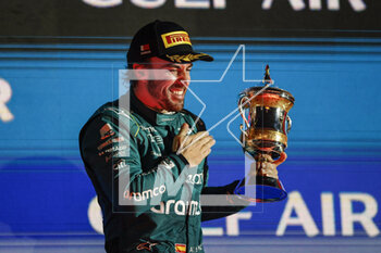 2023-03-05 - ALONSO Fernando (spa), Aston Martin F1 Team AMR23, portrait celebrates with the trophy at the podium during the Formula 1 Gulf Air Bahrain Grand Prix 2023, 1st round of the 2023 FIA Formula One World Championship from March 2 to 5, 2023 on the Bahrain International Circuit, in Sakhir, Bahrain - F1 - BAHRAIN GRAND PRIX 2023 - RACE - FORMULA 1 - MOTORS