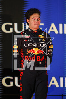 2023-03-05 - PEREZ Sergio (mex), Red Bull Racing RB19, portrait at the podium during the Formula 1 Gulf Air Bahrain Grand Prix 2023, 1st round of the 2023 FIA Formula One World Championship from March 2 to 5, 2023 on the Bahrain International Circuit, in Sakhir, Bahrain - F1 - BAHRAIN GRAND PRIX 2023 - RACE - FORMULA 1 - MOTORS