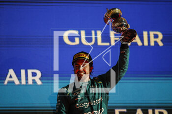 2023-03-05 - ALONSO Fernando (spa), Aston Martin F1 Team AMR23, portrait celebrates his podium with the trophy at the podium during the Formula 1 Gulf Air Bahrain Grand Prix 2023, 1st round of the 2023 FIA Formula One World Championship from March 2 to 5, 2023 on the Bahrain International Circuit, in Sakhir, Bahrain - F1 - BAHRAIN GRAND PRIX 2023 - RACE - FORMULA 1 - MOTORS