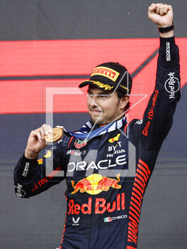 2023-04-30 - PEREZ Sergio (mex), Red Bull Racing RB19, portrait celebrates his victory, win at the podium during the Formula 1 Azerbaijan Grand Prix 2023, 4th round of the 2023 Formula One World Championship from April 28 to 30, 2023 on the Baku City Circuit, in Baku, Azerbaijan - F1 - AZERBAIJAN GRAND PRIX 2023 - RACE - FORMULA 1 - MOTORS