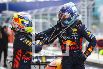2023-05-07 - VERSTAPPEN Max (ned), Red Bull Racing RB19 being congratulated by PEREZ Sergio (mex), Red Bull Racing RB19, portrait for his win during the Formula 1 Crypto.com Miami Grand Prix 2023, 5th round of the 2023 Formula One World Championship from May 05 to 07, 2023 on the Miami International Autodrome, in Miami Gardens, Florida, United States of America - F1 - MIAMI GRAND PRIX 2023 - RACE - FORMULA 1 - MOTORS