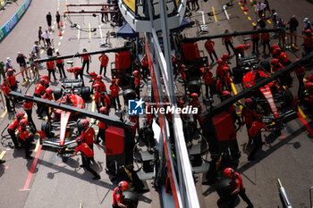 2023-05-25 - Scuderia Ferrari SF-23, mechanics performing pitstop practice in the pitlane during the Formula 1 Grand Prix de Monaco 2023, 6th round of the 2023 Formula One World Championship from May 26 to 28, 2023 on the Circuit de Monaco, in Monaco - F1 - MONACO GRAND PRIX 2023 - FORMULA 1 - MOTORS