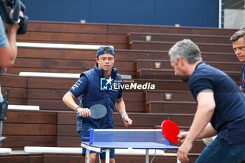2023-05-25 - Nick Devries (NZL) Scuderia AlphaTauri playing table tennis in Redbull Station - 2023 GRAND PRIX DE MONACO - THURSDAY - AMBIENT AND PRESS CONFERENCE - FORMULA 1 - MOTORS