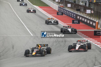 2023-06-04 - 11 PEREZ Sergio (mex), Red Bull Racing RB19, action 27 HULKENBERG Nico (ger), Haas F1 Team VF-23 Ferrari, action during the Formula 1 AWS Gran Premio de Espana 2023, 7th round of the 2023 Formula One World Championship from June 2 to 4, 2023 on the Circuit de Barcelona-Catalunya, in Montmelo, Spain - F1 - SPANISH GRAND PRIX 2023 - RACE - FORMULA 1 - MOTORS