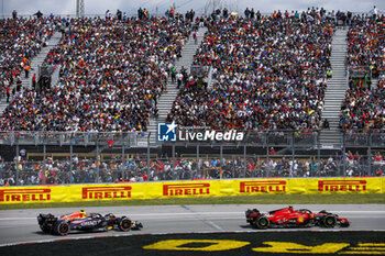 2023-06-18 - 55 SAINZ Carlos (spa), Scuderia Ferrari SF-23, 11 PEREZ Sergio (mex), Red Bull Racing RB19, action during the Formula 1 Pirelli Grand Prix du Canada, 8th round of the 2023 Formula One World Championship from June 16 to 18, 2023 on the Circuit Gilles Villeneuve, in Montréal, Canada - F1 - CANADIAN GRAND PRIX 2023 - RACE - FORMULA 1 - MOTORS