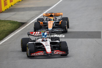 2023-06-18 - 27 HULKENBERG Nico (ger), Haas F1 Team VF-23 Ferrari, action 81 PIASTRI Oscar (aus), McLaren F1 Team MCL60, action during the Formula 1 Pirelli Grand Prix du Canada, 8th round of the 2023 Formula One World Championship from June 16 to 18, 2023 on the Circuit Gilles Villeneuve, in Montréal, Canada - F1 - CANADIAN GRAND PRIX 2023 - RACE - FORMULA 1 - MOTORS