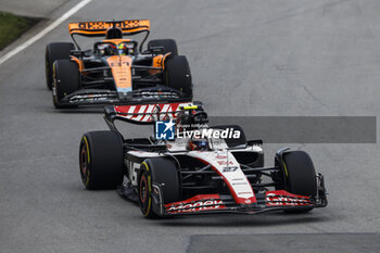 2023-06-18 - 27 HULKENBERG Nico (ger), Haas F1 Team VF-23 Ferrari, action 81 PIASTRI Oscar (aus), McLaren F1 Team MCL60, action during the Formula 1 Pirelli Grand Prix du Canada, 8th round of the 2023 Formula One World Championship from June 16 to 18, 2023 on the Circuit Gilles Villeneuve, in Montréal, Canada - F1 - CANADIAN GRAND PRIX 2023 - RACE - FORMULA 1 - MOTORS