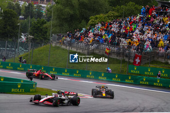 2023-07-01 - 27 HULKENBERG Nico (ger), Haas F1 Team VF-23 Ferrari, 11 PEREZ Sergio (mex), Red Bull Racing RB19, action during the 2023 Formula 1 Rolex Grosser Preis von Osterreich, 2023 Austrian Grand Prix, 9th round of the 2023 Formula One World Championship from June 30 to July 2, 2023 on the Red Bull Ring, in Spielberg, Austria - F1 - AUSTRIAN GRAND PRIX 2023 - FORMULA 1 - MOTORS