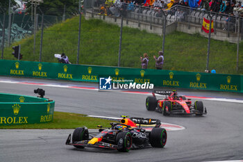 2023-07-01 - 11 PEREZ Sergio (mex), Red Bull Racing RB19, 55 SAINZ Carlos (spa), Scuderia Ferrari SF-23, action during the 2023 Formula 1 Rolex Grosser Preis von Osterreich, 2023 Austrian Grand Prix, 9th round of the 2023 Formula One World Championship from June 30 to July 2, 2023 on the Red Bull Ring, in Spielberg, Austria - F1 - AUSTRIAN GRAND PRIX 2023 - FORMULA 1 - MOTORS