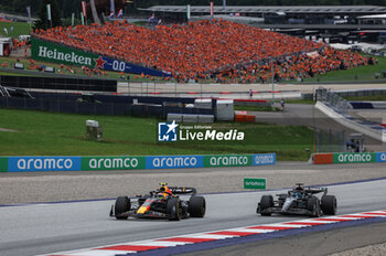 2023-07-02 - 11 PEREZ Sergio (mex), Red Bull Racing RB19, action 63 RUSSELL George (gbr), Mercedes AMG F1 Team W14, action during the 2023 Formula 1 Rolex Grosser Preis von Osterreich, 2023 Austrian Grand Prix, 9th round of the 2023 Formula One World Championship from June 30 to July 2, 2023 on the Red Bull Ring, in Spielberg, Austria - F1 - AUSTRIAN GRAND PRIX 2023 - RACE - FORMULA 1 - MOTORS
