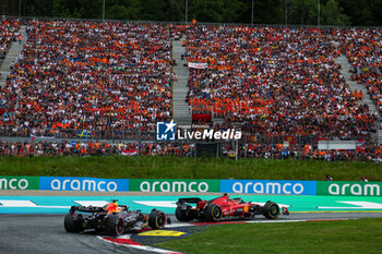 2023-07-02 - 55 SAINZ Carlos (spa), Scuderia Ferrari SF-23, 01 VERSTAPPEN Max (nld), Red Bull Racing RB19, action during the 2023 Formula 1 Rolex Grosser Preis von Osterreich, 2023 Austrian Grand Prix, 9th round of the 2023 Formula One World Championship from June 30 to July 2, 2023 on the Red Bull Ring, in Spielberg, Austria - F1 - AUSTRIAN GRAND PRIX 2023 - RACE - FORMULA 1 - MOTORS