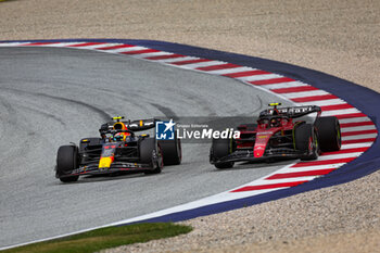2023-07-02 - 11 PEREZ Sergio (mex), Red Bull Racing RB19, 55 SAINZ Carlos (spa), Scuderia Ferrari SF-23, action during the 2023 Formula 1 Rolex Grosser Preis von Osterreich, 2023 Austrian Grand Prix, 9th round of the 2023 Formula One World Championship from June 30 to July 2, 2023 on the Red Bull Ring, in Spielberg, Austria - F1 - AUSTRIAN GRAND PRIX 2023 - RACE - FORMULA 1 - MOTORS