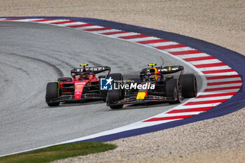 2023-07-02 - 11 PEREZ Sergio (mex), Red Bull Racing RB19, 55 SAINZ Carlos (spa), Scuderia Ferrari SF-23, action during the 2023 Formula 1 Rolex Grosser Preis von Osterreich, 2023 Austrian Grand Prix, 9th round of the 2023 Formula One World Championship from June 30 to July 2, 2023 on the Red Bull Ring, in Spielberg, Austria - F1 - AUSTRIAN GRAND PRIX 2023 - RACE - FORMULA 1 - MOTORS