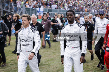 2023-07-09 - PITT Brad (USA), actor playing Sonny Hayes, driver of the fictional Apex APXGP team in the F1 movie by Apple Studios / Bruckheimer Films, portrait IDRIS Damson Alade-Bo (GBR), actor playing Joshua Pearce, driver of the fictional Apex APXGP team in the F1 movie by Apple Studios / Bruckheimer Films, portrait during the 2023 Formula 1 Aramco British Grand Prix, 10th round of the 2023 Formula One World Championship from July 7 to 9, 2023 on the Silverstone Circuit, in Silverstone, United Kingdom - F1 - BRITISH GRAND PRIX 2023 - RACE - FORMULA 1 - MOTORS