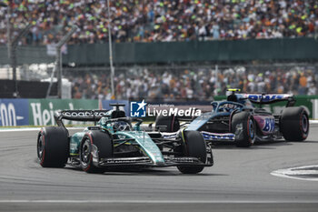 2023-07-09 - 18 STROLL Lance (can), Aston Martin F1 Team AMR23, action 10 GASLY Pierre (fra), Alpine F1 Team A523, action during the 2023 Formula 1 Aramco British Grand Prix, 10th round of the 2023 Formula One World Championship from July 7 to 9, 2023 on the Silverstone Circuit, in Silverstone, United Kingdom - F1 - BRITISH GRAND PRIX 2023 - RACE - FORMULA 1 - MOTORS