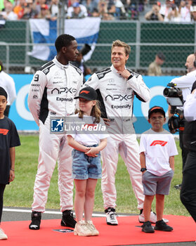 2023-07-09 - starting grid, grille de depart, IDRIS Damson Alade-Bo (GBR), actor playing Joshua Pearce, driver of the fictional Apex APXGP team in the F1 movie by Apple Studios / Bruckheimer Films, PITT Brad (USA), actor playing Sonny Hayes, driver of the fictional Apex APXGP team in the F1 movie by Apple Studios / Bruckheimer Films, portrait during the 2023 Formula 1 Aramco British Grand Prix, 10th round of the 2023 Formula One World Championship from July 7 to 9, 2023 on the Silverstone Circuit, in Silverstone, United Kingdom - F1 - BRITISH GRAND PRIX 2023 - RACE - FORMULA 1 - MOTORS