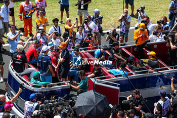 2023-07-23 - The drivers’ parade onboard an old bus during the 2023 Formula 1 Qatar Airways Hungarian Grand Prix, 11th round of the 2023 Formula One World Championship from July 21 to 23, 2023 on the Hungaroring, in Mogyorod, Hungary - F1 - HUNGARIAN GRAND PRIX 2023 - RACE - FORMULA 1 - MOTORS