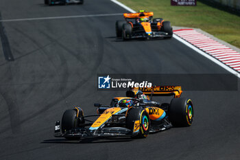 2023-07-23 - 81 PIASTRI Oscar (aus), McLaren F1 Team MCL60, 04 NORRIS Lando (gbr), McLaren F1 Team MCL60, action during the 2023 Formula 1 Qatar Airways Hungarian Grand Prix, 11th round of the 2023 Formula One World Championship from July 21 to 23, 2023 on the Hungaroring, in Mogyorod, Hungary - F1 - HUNGARIAN GRAND PRIX 2023 - RACE - FORMULA 1 - MOTORS