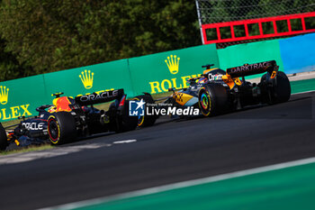 2023-07-23 - 11 PEREZ Sergio (mex), Red Bull Racing RB19, 81 PIASTRI Oscar (aus), McLaren F1 Team MCL60, action during the 2023 Formula 1 Qatar Airways Hungarian Grand Prix, 11th round of the 2023 Formula One World Championship from July 21 to 23, 2023 on the Hungaroring, in Mogyorod, Hungary - F1 - HUNGARIAN GRAND PRIX 2023 - RACE - FORMULA 1 - MOTORS