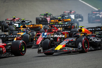 2023-07-30 - 55 SAINZ Carlos (spa), Scuderia Ferrari SF-23, 11 PEREZ Sergio (mex), Red Bull Racing RB19, action during the 2023 Formula 1 MSC Cruises Belgian Grand Prix, 12th round of the 2023 Formula One World Championship from July 28 to 30, 2023 on the Circuit de Spa-Francorchamps, in Stavelot, Belgium - F1 - BELGIAN GRAND PRIX 2023 - RACE - FORMULA 1 - MOTORS