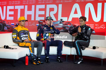2023-08-26 - Press conference: NORRIS Lando (gbr), McLaren F1 Team MCL60, VERSTAPPEN Max (ned), Red Bull Racing RB19, RUSSELL George (gbr), Mercedes AMG F1 Team W14, portrait, during the 2023 Formula 1 Heineken Dutch Grand Prix, 13th round of the 2023 Formula One World Championship from August 25 to 28, 2023 on the Zandvoort Circuit, in Zandvoort, Netherlands - F1 - DUTCH GRAND PRIX 2023 - FORMULA 1 - MOTORS