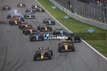 2023-08-27 - 01 VERSTAPPEN Max (nld), Red Bull Racing RB19, action, start with 04 NORRIS Lando (gbr), McLaren F1 Team MCL60 during the dutch hymn prior to the start during the 2023 Formula 1 Heineken Dutch Grand Prix, 13th round of the 2023 Formula One World Championship from August 25 to 28, 2023 on the Zandvoort Circuit, in Zandvoort, Netherlands - F1 - DUTCH GRAND PRIX 2023 - RACE - FORMULA 1 - MOTORS