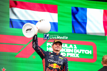 2023-08-27 - VERSTAPPEN Max (ned), Red Bull Racing RB19, portrait celebrating victory on the podium during the 2023 Formula 1 Heineken Dutch Grand Prix, 13th round of the 2023 Formula One World Championship from August 25 to 28, 2023 on the Zandvoort Circuit, in Zandvoort, Netherlands - F1 - DUTCH GRAND PRIX 2023 - RACE - FORMULA 1 - MOTORS
