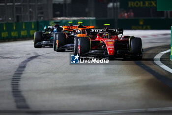 2023-09-17 - 55 SAINZ Carlos (spa), Scuderia Ferrari SF-23, 04 NORRIS Lando (gbr), McLaren F1 Team MCL60, 63 RUSSELL George (gbr), Mercedes AMG F1 Team W14, action during the 2023 Formula 1 Singapore Airlines Singapore Grand Prix, 15th round of the 2023 Formula One World Championship from September 15 to 17, 2023 on the Marina Bay Street Circuit, in Singapore - F1 - SINGAPORE GRAND PRIX 2023 - RACE - FORMULA 1 - MOTORS