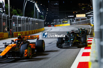 2023-09-17 - 04 NORRIS Lando (gbr), McLaren F1 Team MCL60, 63 RUSSELL George (gbr), Mercedes AMG F1 Team W14, 44 HAMILTON Lewis (gbr), Mercedes AMG F1 Team W14, action during the 2023 Formula 1 Singapore Airlines Singapore Grand Prix, 15th round of the 2023 Formula One World Championship from September 15 to 17, 2023 on the Marina Bay Street Circuit, in Singapore - F1 - SINGAPORE GRAND PRIX 2023 - RACE - FORMULA 1 - MOTORS