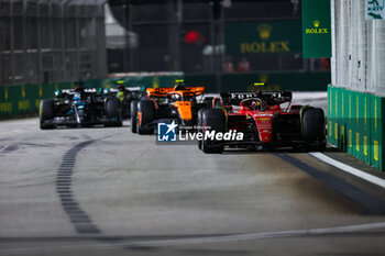 2023-09-17 - 55 SAINZ Carlos (spa), Scuderia Ferrari SF-23, 04 NORRIS Lando (gbr), McLaren F1 Team MCL60, 63 RUSSELL George (gbr), Mercedes AMG F1 Team W14, 44 HAMILTON Lewis (gbr), Mercedes AMG F1 Team W14, action, during the 2023 Formula 1 Singapore Airlines Singapore Grand Prix, 15th round of the 2023 Formula One World Championship from September 15 to 17, 2023 on the Marina Bay Street Circuit, in Singapore - F1 - SINGAPORE GRAND PRIX 2023 - RACE - FORMULA 1 - MOTORS