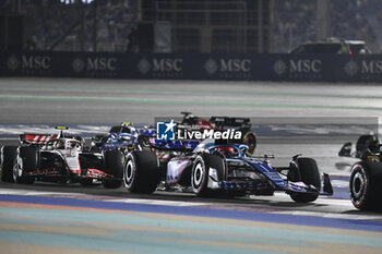 2023-10-07 - 31 OCON Esteban (fra), Alpine F1 Team A523, action 27 HULKENBERG Nico (ger), Haas F1 Team VF-23 Ferrari, action during the 2023 Formula 1 Qatar Grand Prix, 17th round of the 2023 Formula One World Championship from October 6 to 8, 2023 on the Lusail International Circuit, in Doha, Qatar - F1 - QATAR GRAND PRIX 2023 - FORMULA 1 - MOTORS