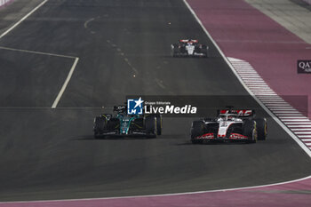 2023-10-08 - 18 STROLL Lance (can), Aston Martin F1 Team AMR23, action 20 MAGNUSSEN Kevin (den), Haas F1 Team VF-23 Ferrari, action during the 2023 Formula 1 Qatar Grand Prix, 17th round of the 2023 Formula One World Championship from October 6 to 8, 2023 on the Lusail International Circuit, in Doha, Qatar - F1 - QATAR GRAND PRIX 2023 - RACE - FORMULA 1 - MOTORS
