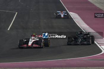 2023-10-08 - 27 HULKENBERG Nico (ger), Haas F1 Team VF-23 Ferrari, action 63 RUSSELL George (gbr), Mercedes AMG F1 Team W14, action during the 2023 Formula 1 Qatar Grand Prix, 17th round of the 2023 Formula One World Championship from October 6 to 8, 2023 on the Lusail International Circuit, in Doha, Qatar - F1 - QATAR GRAND PRIX 2023 - RACE - FORMULA 1 - MOTORS