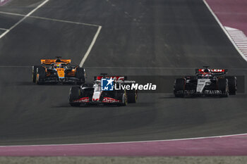 2023-10-08 - 20 MAGNUSSEN Kevin (den), Haas F1 Team VF-23 Ferrari, action 40 LAWSON Liam (nzl), Scuderia AlphaTauri AT04, action 81 PIASTRI Oscar (aus), McLaren F1 Team MCL60, action during the 2023 Formula 1 Qatar Grand Prix, 17th round of the 2023 Formula One World Championship from October 6 to 8, 2023 on the Lusail International Circuit, in Doha, Qatar - F1 - QATAR GRAND PRIX 2023 - RACE - FORMULA 1 - MOTORS