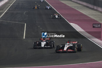 2023-10-08 - 40 LAWSON Liam (nzl), Scuderia AlphaTauri AT04, action 20 MAGNUSSEN Kevin (den), Haas F1 Team VF-23 Ferrari, action during the 2023 Formula 1 Qatar Grand Prix, 17th round of the 2023 Formula One World Championship from October 6 to 8, 2023 on the Lusail International Circuit, in Doha, Qatar - F1 - QATAR GRAND PRIX 2023 - RACE - FORMULA 1 - MOTORS
