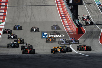 2023-10-22 - start of the race, depart, 04 NORRIS Lando (gbr), McLaren F1 Team MCL60, action 16 LECLERC Charles (mco), Scuderia Ferrari SF-23, action 55 SAINZ Carlos (spa), Scuderia Ferrari SF-23, action during the 2023 Formula 1 Lenovo United States Grand Prix, 18th round of the 2023 Formula One World Championship from October 20 to 22, 2023 on the Circuit of The Americas, in Austin, USA - F1 - US GRAND PRIX 2023 - RACE - FORMULA 1 - MOTORS