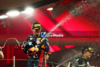 2023-11-26 - VERSTAPPEN Max (ned), Red Bull Racing RB19, portrait celebrates his victory on podium during the 2023 Formula 1 Etihad Airways Abu Dhabi Grand Prix, 22th round of the 2023 Formula One World Championship from November 24 to 26, 2023 on the Yas Marina Circuit, in Abu Dhabi - F1 - ABU DHABI GRAND PRIX 2023 - RACE - FORMULA 1 - MOTORS