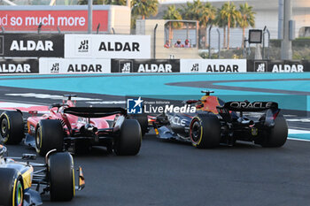2023-11-26 - 01 VERSTAPPEN Max (nld), Red Bull Racing RB19, 16 LECLERC Charles (mco), Scuderia Ferrari SF-23, action overtake, overtaking, dépassement, depassement, overtakes, during the 2023 Formula 1 Etihad Airways Abu Dhabi Grand Prix, 22th round of the 2023 Formula One World Championship from November 24 to 26, 2023 on the Yas Marina Circuit, in Abu Dhabi - F1 - ABU DHABI GRAND PRIX 2023 - RACE - FORMULA 1 - MOTORS