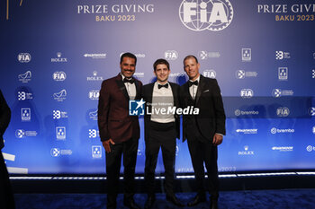 2023-12-08 - AL-ATTIYAH Nasser, FIA World Rally-Raid Championship - Champion, portrait with BAUMEL Mathieu, FIA World Rally-Raid Championship Co-Driver - Champion, portrait and ROUSSEL Jérôme during the 2023 FIA Prize Giving Ceremony in Baky on December 8, 2023 at Baku Convention Center in Baku, Azerbaijan - FIA PRIZE GIVING 2023 - BAKU - FORMULA 1 - MOTORS