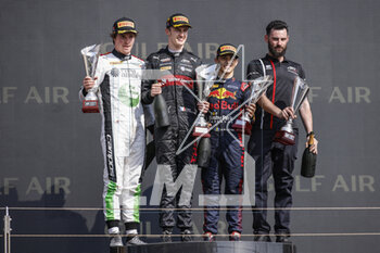 2023-03-05 - POURCHAIRE Théo (fra), ART Grand Prix, Dallara F2, portrait celebrates his victory at the podium with the trophy BOSCHUNG Raplh (swi), Campos Racing, Dallara F2, portrait MALONEY Zane (bb), Rodin Carlin, Dallara F2, portrait during the 1st round of the 2023 FIA Formula 2 Championship from March 2 to 5, 2023 on the Bahrain International Circuit, in Sakhir, Bahrain - AUTO - FORMULA 2 2023 - BAHRAIN - FORMULA 2 - MOTORS