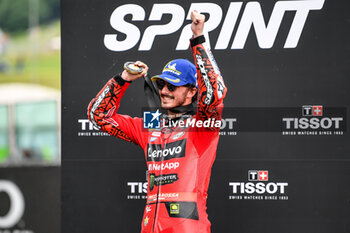 2023-06-10 - Francesco Bagnaia IT Ducati Lenovo Team Ducati celebrates on the podium after winning the Gran Premio d'Italia Oakley - TISSOT SPRINT MOTOGP GRAND PRIX OF ITALY - MOTOGP - MOTORS
