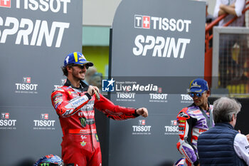 2023-06-10 - Francesco Bagnaia IT Ducati Lenovo Team Ducati celebrates on the podium after winning the Tissot Sprint race - TISSOT SPRINT MOTOGP GRAND PRIX OF ITALY - MOTOGP - MOTORS