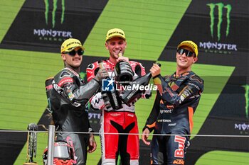 2023-09-03 - Jake Dixon (1st) of United Kingdom of Great Britain and Northern Ireland and GASGAS Aspar Team , Aron Canet (2nd) of Spain and Pons Wegow Los40 and Albert Arenas (3rd) of Spain and Red Bull KTM Ajo during the MOTO 2 PODIUM of the Catalunya Grand Prix at Montmelo racetrack, Spain on September 03, 2023 (Photo: Alvaro Sanchez) Cordon Press - RACES MOTOGP CATALUNYA - MOTOGP - MOTORS