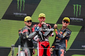 2023-09-03 - Jake Dixon (1st) of United Kingdom of Great Britain and Northern Ireland and GASGAS Aspar Team , Aron Canet (2nd) of Spain and Pons Wegow Los40 and Albert Arenas (3rd) of Spain and Red Bull KTM Ajo during the MOTO 2 PODIUM of the Catalunya Grand Prix at Montmelo racetrack, Spain on September 03, 2023 (Photo: Alvaro Sanchez) Cordon Press - RACES MOTOGP CATALUNYA - MOTOGP - MOTORS