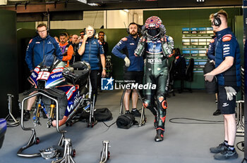 2023-11-25 - Lorenzo Savadori ITA CryptoDATA RNF MotoGP Team portrait waits in the box - 2023 MOTOGP GRAND PRIX OF SPAIN - GRAN PREMIO MOTUL DE LA COMUNITAT VALENCIANA - PADDOCK AND BOX - MOTOGP - MOTORS