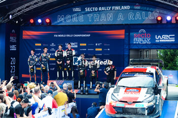 2023-08-06 - The DriveThierry Neuville (Bel) The Co-Pilot Martijn Wydaeghe (Bel), Elfyn Evans (Gb) The Co-Pilot Scott Martin (Gb)Takamoto Katsuta (Jpn) The Co-Pilot Aaron Johnston (Irl), During Wrc Rally Finland ,They Celebrate During The Final Podium In Himos,2023,06 Aug 2023 Jyvaskyla,Finland - FIA WORLD RALLY CHAMPIONSHIP WRC SECTO AUTOMOTIVE RALLY FINLAND 2023 - RALLY - MOTORS