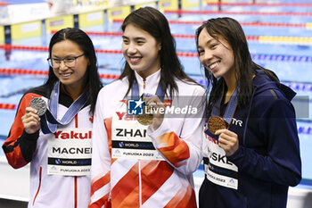 2023-07-24 - Margaret MacNeil of Canada 2nd place, Yufei Zhang of China 1st place, Torri Huske of United States 3rd place, Women's 100m Butterfly Medal Ceremony during the 20th FINA Swimming World Championships Fukuoka 2023 on July 24, 2023 at Marine Messe Fukuoka in Fukuoka, Japan - SWIMMING - WORLD CHAMPIONSHIPS 2023 - SWIMMING - SWIMMING