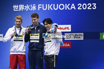 2023-07-27 - Krzysztof Chmielewski of Poland Silver medal, Leon Marchand of France Gold medal, Tomoru Honda of Japan Bronze medal, Men's 200m Butterfly Medal Ceremony during the 20th FINA Swimming World Championships Fukuoka 2023 on July 26, 2023 at Marine Messe Fukuoka in Fukuoka, Japan - SWIMMING - WORLD CHAMPIONSHIPS 2023 - SWIMMING - SWIMMING